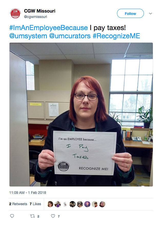 Laura Serwe poses with a sign